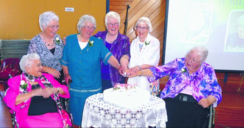 The jubililarians cut the cake. From left, Srs Justin Collins, Noeline Landrigan, Francesca Bourke, Catherine Shelton, Von Wittn, Mary McKenna.