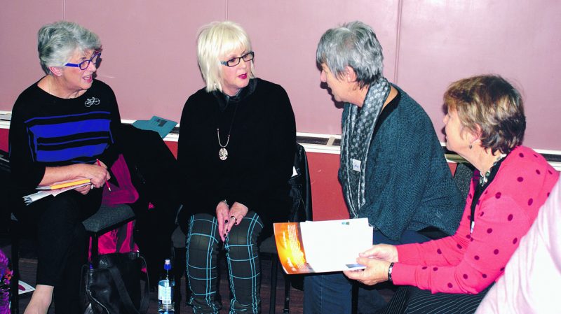 Participants at the Moot, including Liz Pennell (second from left), discuss one of the topics in a small group.