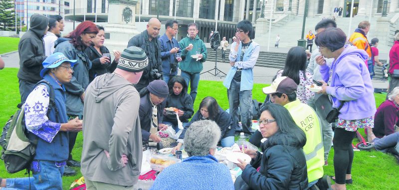 People gathered and shared food and fellowship at the picnic at Parliament.