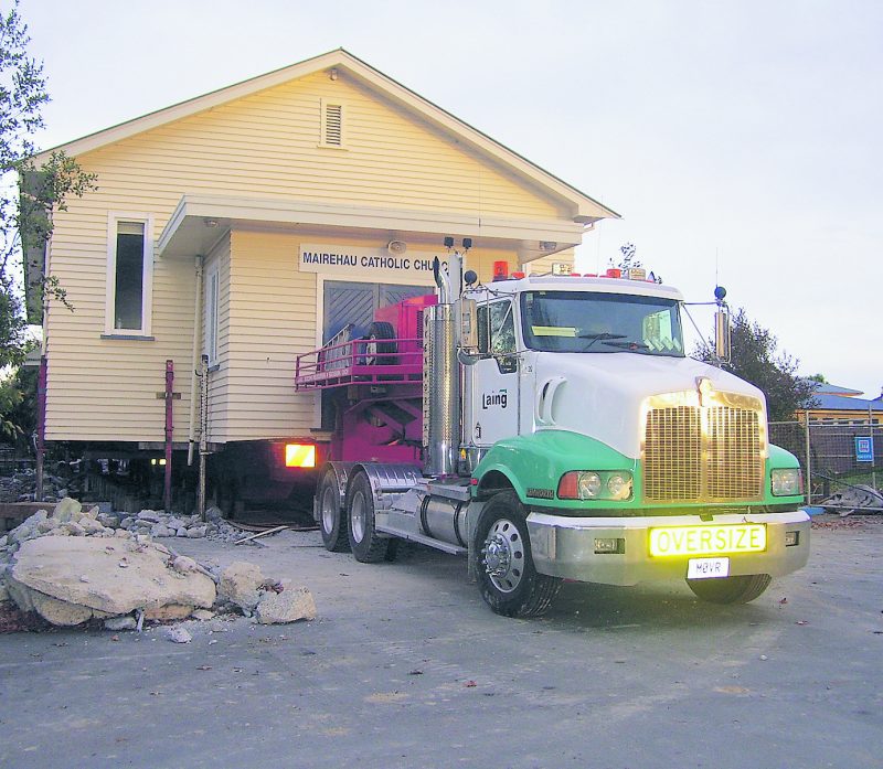 St Francis of Assisi parish church on the move. The school is visible background (right side).