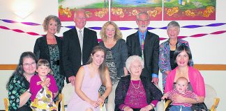Moira Carew surrounded by three generations of her family on the occasion of her 100th birthday at Milford, Auckland.