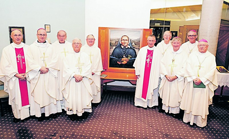 Bishops at the Assembly of Oceania Bishops gather in front of the new painting of Suzanne Aubert.