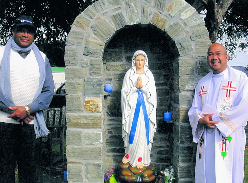 Fr Selvan Benedict, left, and Fr Alfonso Dujali, MSP, alongside the new Helensville grotto.