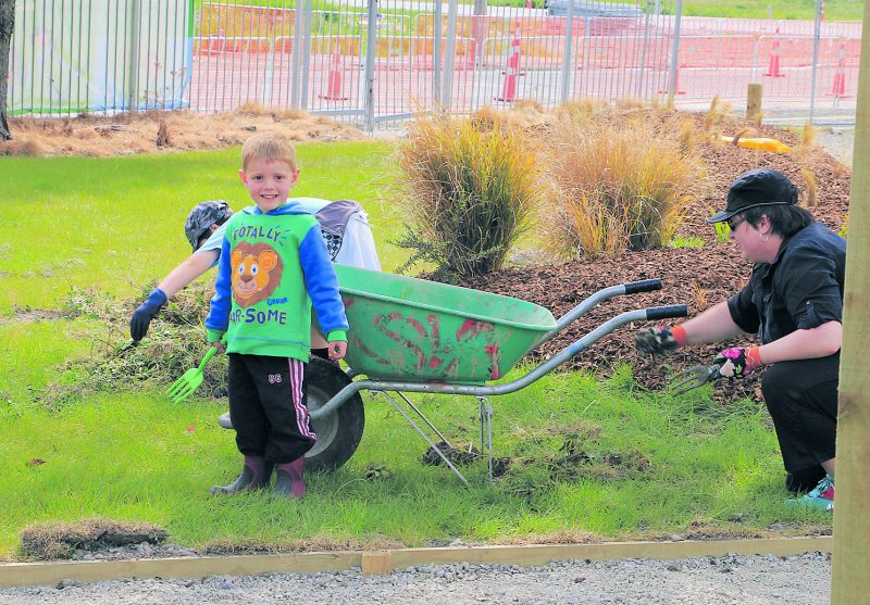 Youngster Benjamin Robb enjoys helping with the garden work.