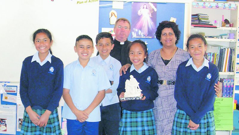Room 5 children at St Joseph’s School in Grey Lynn, who raised money for the missions before Christmas, with Fr Andrew Matthew  and teacher Lydia Victor.