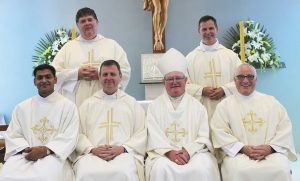 From left, after the ordination ceremony, Deacon Joseph George, Bishop-Elect Stephen Lowe, Bishop Denis Browne and Deacon Stuart Young and, at rear, Frs Richard Laurenson and Mark O’Keeffe.