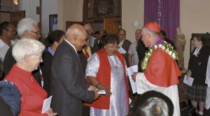Cardinal Dew meets people in the cathedral foyer following the service.