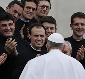 Pope Francis greets clergy during his general audience in St. Peter's Square at the Vatican March 4. (CNS photo/Paul Haring) See POPE-AUDIENCE March 4, 2015.