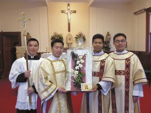From left: Seminarian Huynh Tran, new deacons Thanh Tran and Tien Cao and Fr Binh.