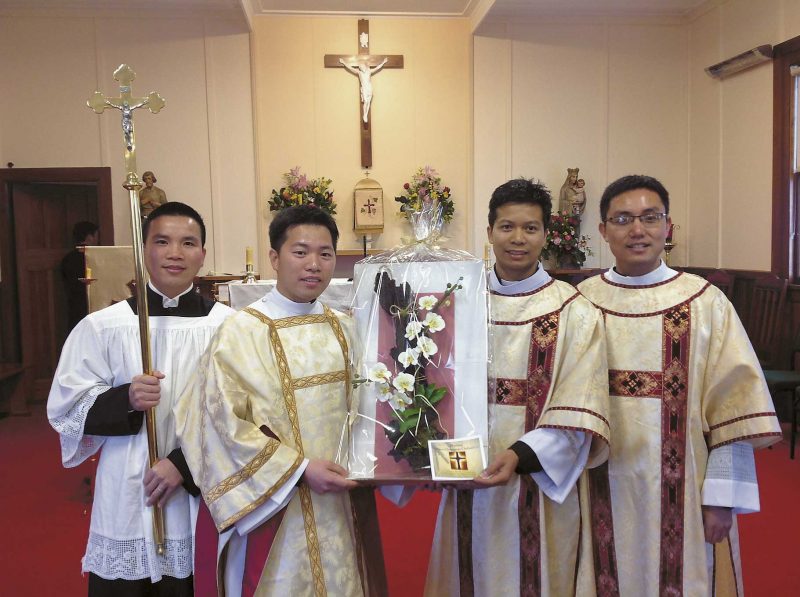 From left: Seminarian Huynh Tran, new deacons Thanh Tran and Tien Cao and Fr Binh.