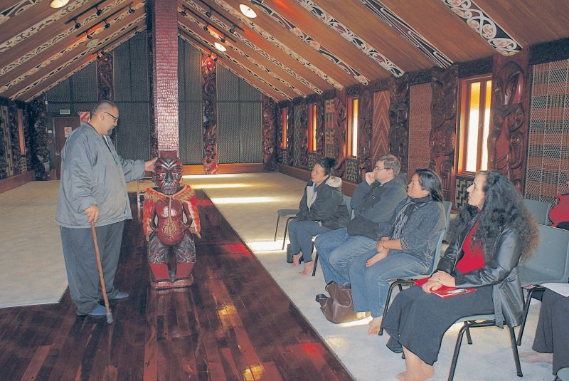 Manuel Beazley explains the significance of a carving of Te Wherowhero at Te Wai Ariki whare in Otara.