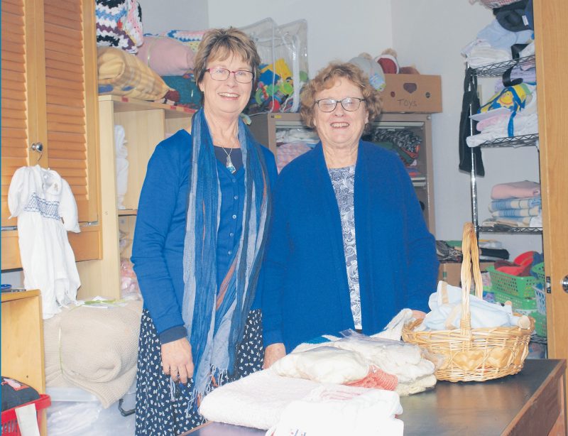 Julia McFadden and Colleen Petrecevich in the sorting room at Pregnancy Help — besides St
Patrick’s Cathedral, Auckland.