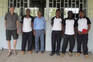 Rob Powell, left, and instructors at Don Bosco Technical Institute in the Solomon Islands.