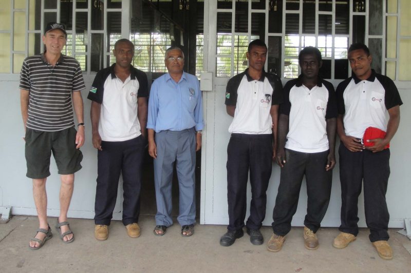 Rob Powell, left, and instructors at Don Bosco Technical Institute in the Solomon Islands.