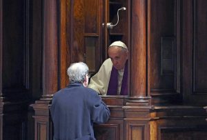 Pope Francis hears confession during a penitential liturgy in early March in St Peter’s Basilica at the Vatican. During his Angelus on August 2, Pope Francis told people not to be afraid or ashamed to go to confession. (CNS photo)