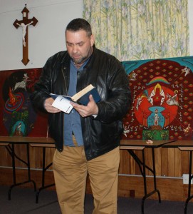 Robert Loretz reads from the Book of Revelation.