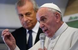 Meeting reporters on plane, pope defends his teaching on social issues