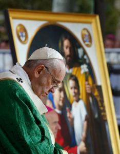 An image of the Holy Family is seen as Pope Francis celebrates the closing Mass of the World Meeting of Families on Benjamin Franklin Parkway in Philadelphia Sept. 27. (CNS photo/Paul Haring) See POPE-FAMILY-MASS Sept. 27, 2015.