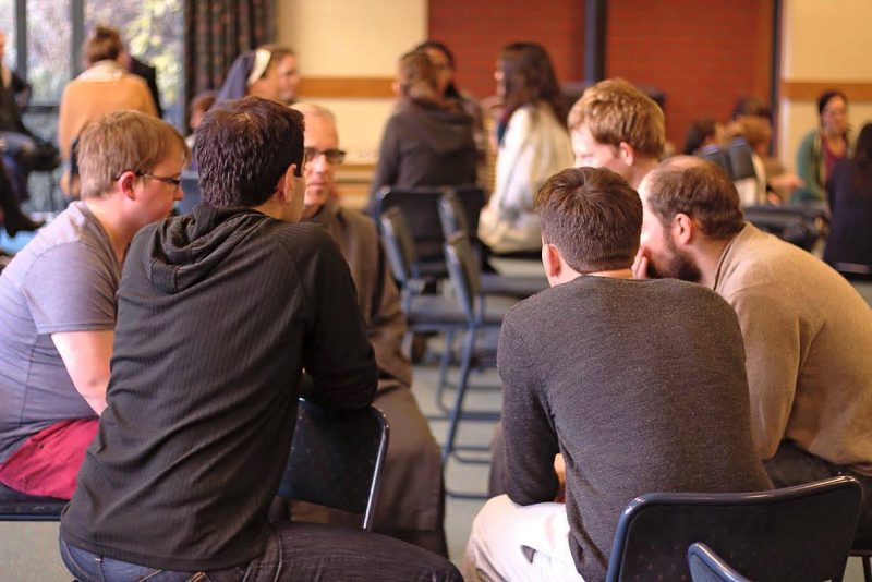 Young people share ideas at the Young Adults Retreat on Banks Peninsula.