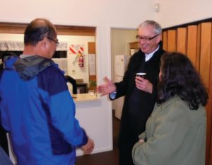 Bishop Patrick Dunn meets parishioners at Pakuranga.