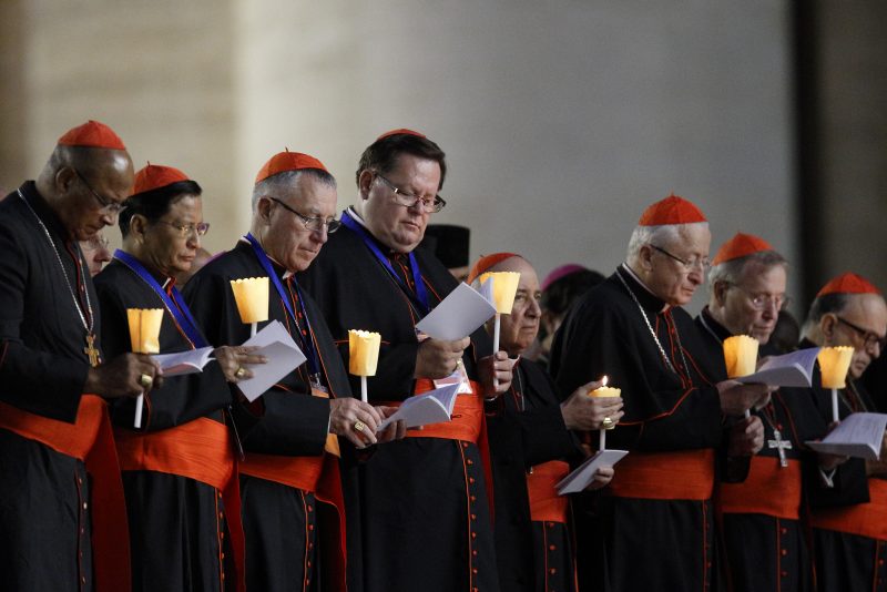 Wellington Cardinal John Dew (third from left) attends a prayer vigil for the Synod of Bishops on the family in St. Peter's Square at the Vatican Oct. 3. (CNS/Paul Haring) See POPE-SYNOD-MASS Oct. 4, 2015.