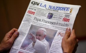 Man reads Italian newspaper in Rome, Oct. 21, claiming Pope Francis has a benign brain tumor. The Vatican spokesman said claims that the pope has a tumor are "entirely unfounded." (CNS photo/Tony Gentile, Reuters) See LOMBARDI-POPE-HEALTH-DENIAL Oct. 21, 2015. EDITORS: For editorial use only.