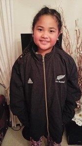 Emma Pouanga enjoys  trying on the Dan Carter jacket.