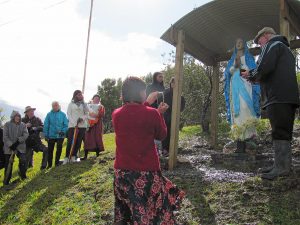 Fr Kerry Prendeville, SM, blesses the statue, Our Lady of the Highway, with locals in attendance. 