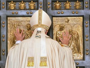 Pope Francis opens the Holy Door of St. Peter's Basilica to inaugurate the Jubilee Year of Mercy at the Vatican Dec. 8. (CNS photo/Maurizio Brambatti, EPA) See POPE-MERCY-DOOR Dec. 8, 2015.