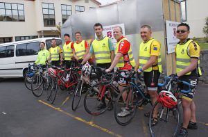 Long-distance cyclists, from left to right: Cirilo Barlis, Matt Gibson, Thomas Park, Isaac Fransen, Fadi Boless, Tony King Archer, Fr Michael Gielen and Tien Phan. 