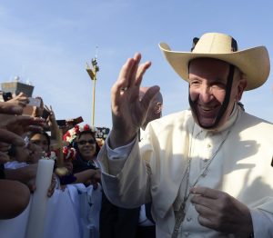 Pope Francis greets the crowd while wearing a hat before celebrating Mass with priests and religious at a stadium in Morelia, Mexico, Feb. 16. (CNS photo/L'Osservatore Romano via EPA) See POPE-MEXICO-CLERGY Feb. 16, 2016.