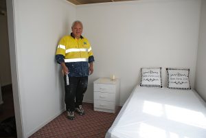 Richard Ngoungoumaui shows off a refurbished bedroom in the boys accommodation block.