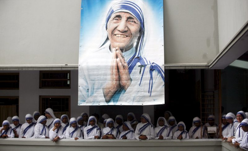 A poster of Blessed Teresa of Kolkata and Missionaries of Charity are seen in Kolkata, India, in this Sept. 5, 2007, file photo. Pope Francis will declare her a saint at the Vatican Sept. 4, the conclusion of the Year of Mercy jubilee for those engaged in works of mercy. (CNS photo/Jayanta Shaw, Reuters) See POPE-SAINTS-DATES March 15, 2016.