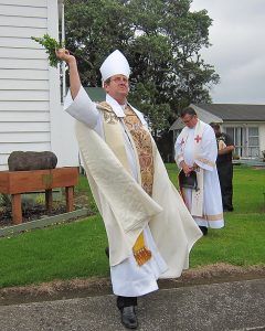 Bishop Steve Lowe blesses the Door of Mercy, the church and its surrounds.