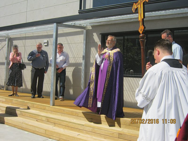 Christchurch diocese administrator Fr Rick Loughnan blesses the
new cathedral parish building.
