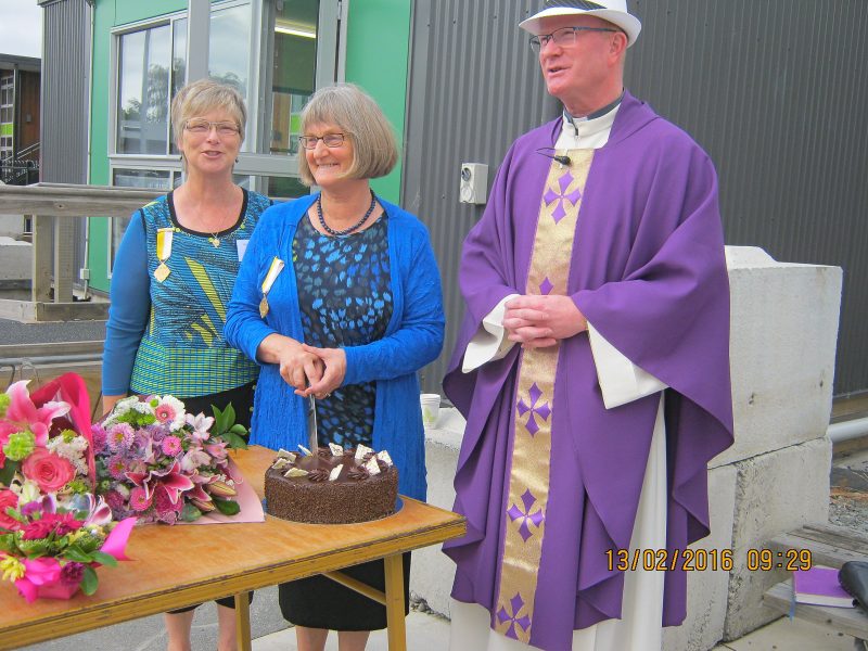 Liz Mulholland, centre, with parish chairwoman Sue McTague and Fr Simon Eccleton, is honoured for her 25 years of service to her local church.
