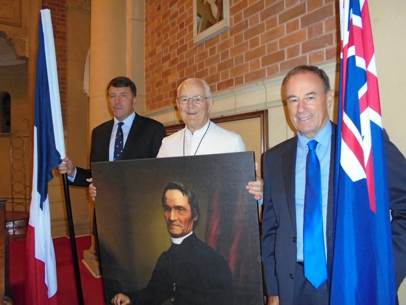 Before the opening procession were (from left) Pompallier College, Whangarei, principal Richard Stanton (with flag
of France); Br Richard Dunleavy, FMS, (with copy of Lindauer portrait of Fr Garin); and Auckland diocese Catholic
Education Services manager Paul Mahoney (with New Zealand flag).
