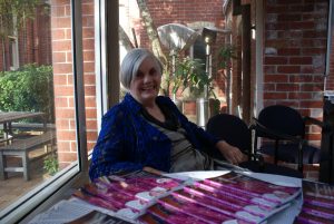 Diane Taylor with copies of her book about Bishop Jean Baptiste Pompallier.