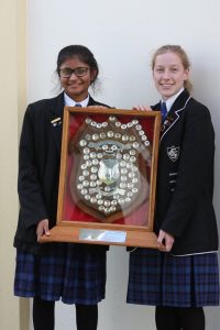 St Catherine’s College head girl Kathryn Prince (right), and deputy head girl Elisha Prasad (left), hold the shield.