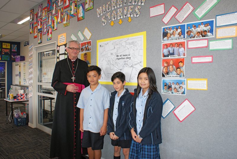 Bishop Dunn with St Anne’s pupils (from left), Talon Shelford, Leonel Dinkha and Bianca Velasco.
