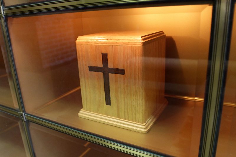 An urn containing cremated remains is seen in a niche in the Holy Rood Cemetery mausoleum in Westbury, N.Y., in 2010. During an Oct. 25 news conference in Rome, Cardinal Gerhard Muller, prefect of the Congregation for the Doctrine of the Faith, said that while the Catholic Church continues to prefer burial in the ground, it accepts cremation as an option, but forbids the scattering of ashes or keeping cremated remains at home. (CNS photo/Gregory A. Shemitz) See VATICAN-LETTER-ASHES Oct. 25, 2016.