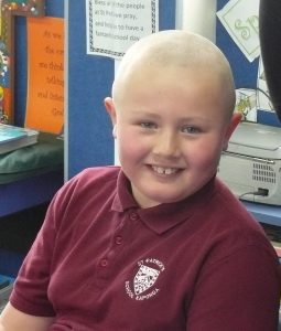 Cart McKenzie raised a little less than $1,000 by growing and shaving off his hair.