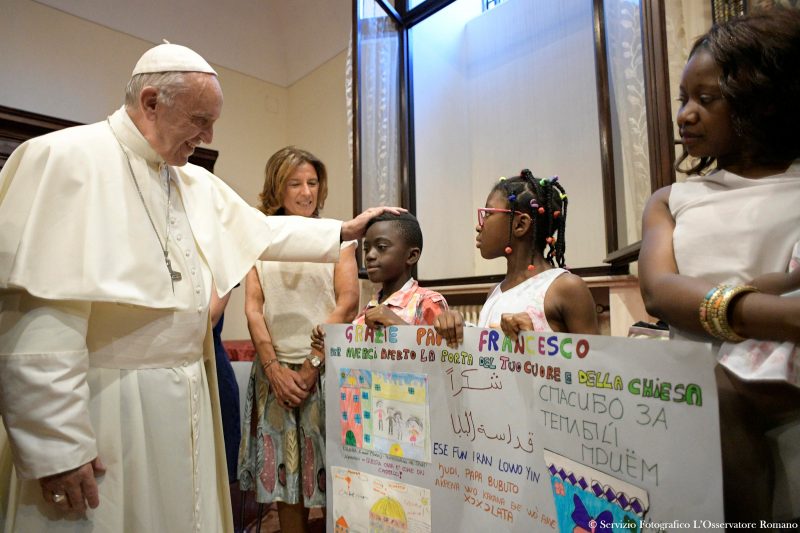 Pope Francis greets young refugees during a conference on families and adolescent education at Rome's Basilica of St. John Lateran. (CNS photo/L'Osservatore Romano via Reuters) See POPE-ROME-CONVENTION June 19, 2017.