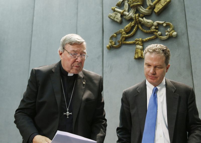 Australian Cardinal George Pell leaves after delivering a statement in the Vatican press office June 29. Also pictured is Greg Burke, Vatican spokesman. Speaking after Australian authorities filed sexual abuse charges against him, the cardinal denied all charges and told reporters he looks forward to having an opportunity to defend himself in court. (CNS photo/Paul Haring) See PELL-ABUSE-CHARGES June 29, 2017.
