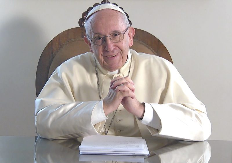 A screenshot shows Pope Francis smiling during a video message from the Vatican to young people of the Caribbean attending the July 10-23 youth assembly sponsored by the Antilles bishops' conference. (CNS photo/Vatican Media) See POPE-ANTILLES-YOUNG July 16, 2018.