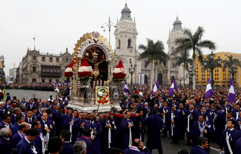 Men carry a replica of Peru's most revered religious icon, the "Lord of Miracles," during an Oct. 18 procession in Lima. Each year thousands of Catholics gather to commemorate the image's survival in a 17th-century earthquake that destroyed Lima. (CNS photo/Mariana Bazo, Reuters)