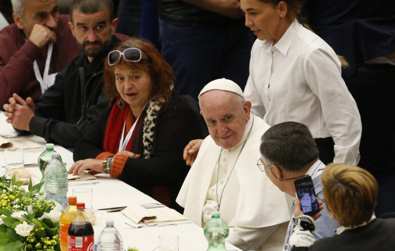 Pope Francis eats lunch with poor people as he marks World Day of the Poor at the Vatican Nov. 18. Some 1,500 people joined the pope for lunch in Paul VI hall. (CNS photo/Paul Haring) See POPE-POOR-MASS Nov. 18, 2018.