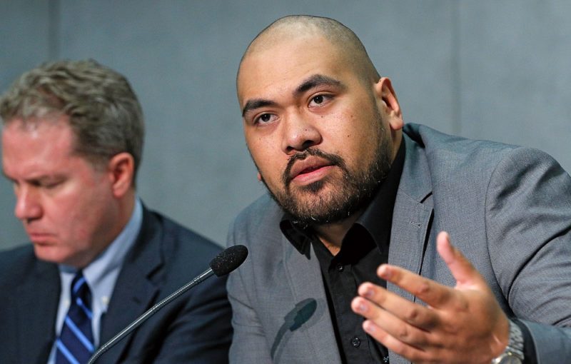 Samoan observer Joseph Sapati Moeono-Kolio speaks at a briefing to discuss the Synod of Bishops on young people, the faith and vocational discernment at the Vatican Oct. 23. At left is Greg Burke, Vatican spokesman. (CNS photo/Paul Haring) See SYNOD-BRIEFING-OCT23 Oct. 23, 2018.