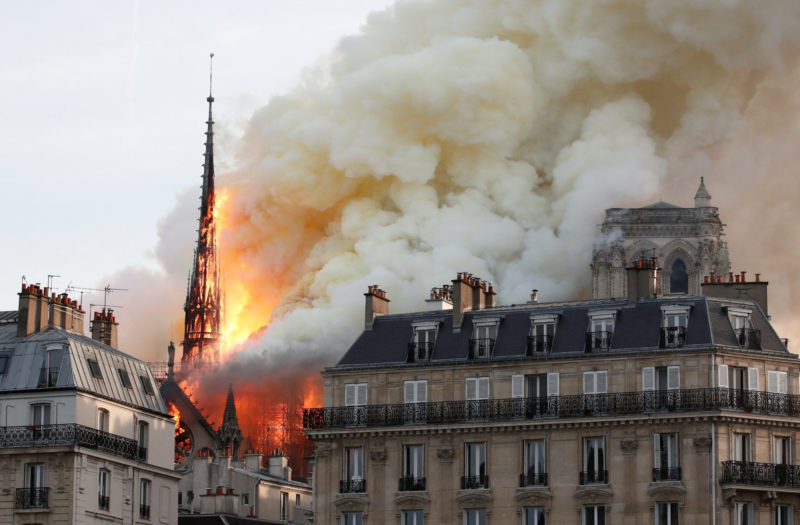 Flames and smoke billow from the Notre Dame Cathedral after a fire broke out in Paris April 15, 2019. Officials said the cause was not clear, but that the fire could be linked to renovation work. (CNS photo/Benoit Tessier, Reuters) See PARIS-NOTRE-DAME-FIRE April 15, 2019.