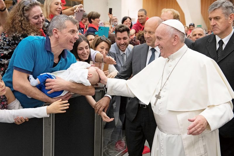 Pope Francis touches a baby during an audience with members of the Catholic Charismatic Renewal International Service in Paul VI hall at the Vatican June 8, 2019. (CNS photo/Vatican Media handout via Reuters) See POPE-CHARIS-LOVE June 10, 2019.